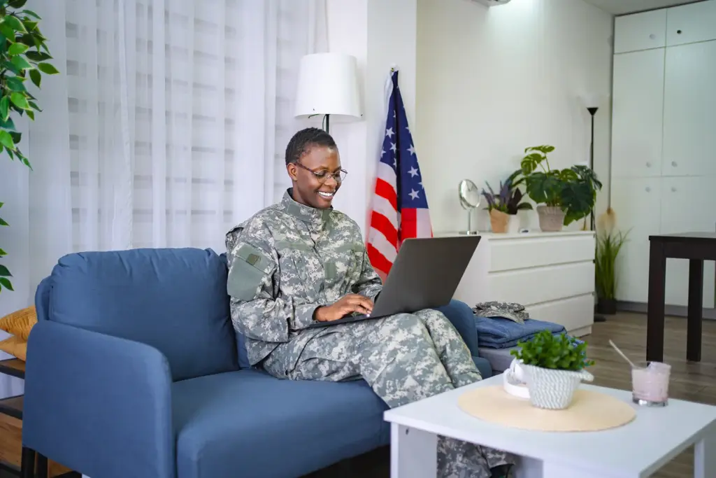 smiling-african-american-female-soldier-using-lapt-2025-08-27-10-58-01-utc